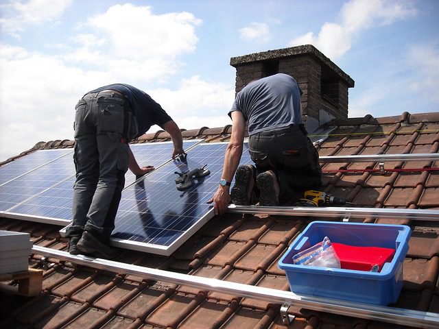 solar panels being installed on roof