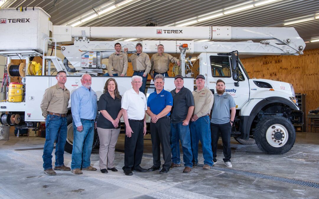 TCEMC team at bucket truck for annual report